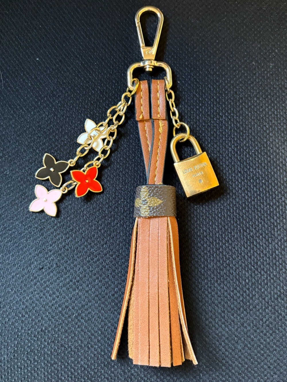 Authentic Louis Vuitton lock on leather tassel with unbranded charms (No Key)